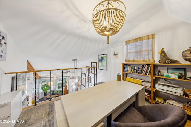 office with lofted ceiling and a chandelier