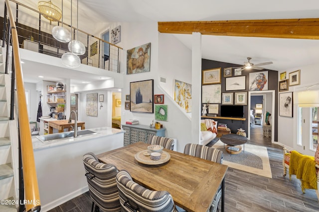 dining area featuring beamed ceiling, ceiling fan, high vaulted ceiling, and sink