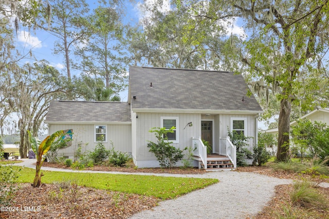 view of front of property with roof with shingles