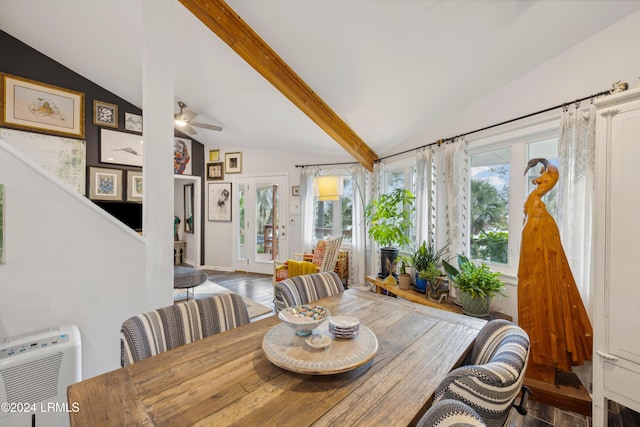 dining room with wood-type flooring, plenty of natural light, vaulted ceiling with beams, and ceiling fan