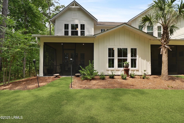 17 Marlowe Way Unit 1, Bluffton, SC 29910 - back of house with a sunroom, a yard, and board and batten siding