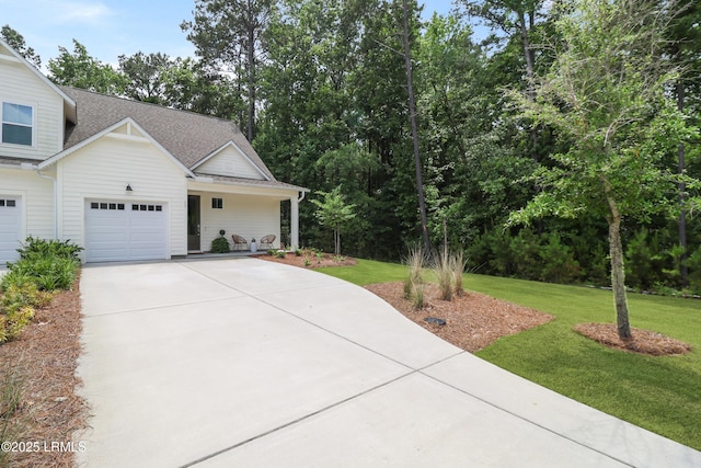 17 Marlowe Way Unit 1, Bluffton, SC 29910 - view of home's exterior with driveway, a garage, a lawn, and roof with shingles