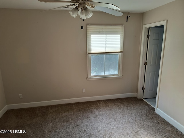 1317 Broad St, Beaufort, SC 29902 - unfurnished bedroom featuring baseboards, a ceiling fan, and carpet flooring