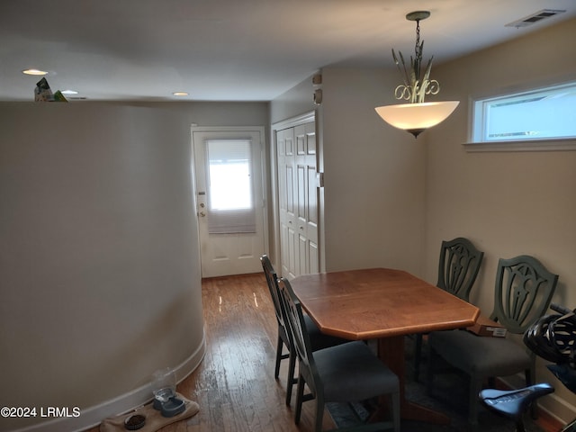 dining space with hardwood / wood-style flooring