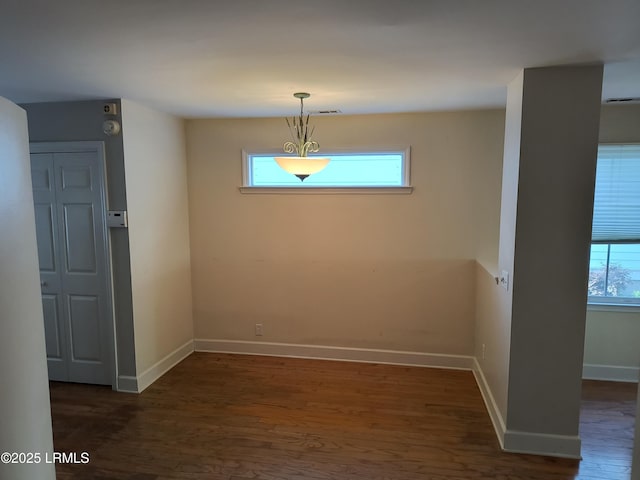 1317 Broad St, Beaufort, SC 29902 - empty room with baseboards and dark wood-type flooring