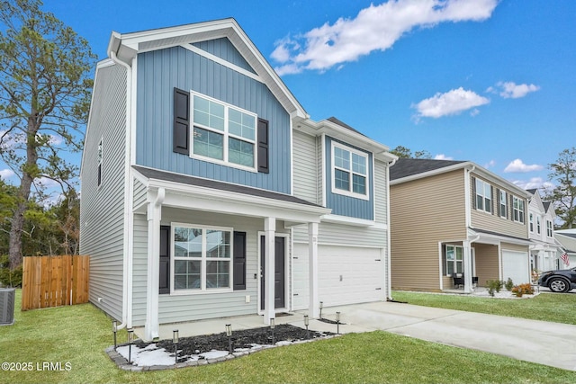 view of front of property with a garage and a front yard