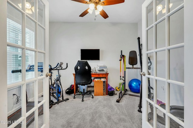 carpeted office space with french doors and ceiling fan