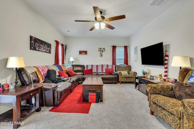 carpeted living room featuring ceiling fan