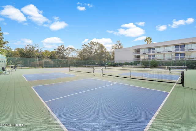 view of sport court featuring basketball hoop