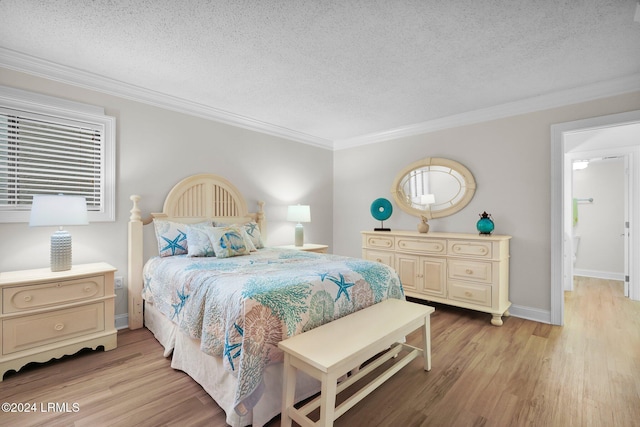 bedroom featuring crown molding, light hardwood / wood-style floors, and a textured ceiling