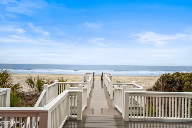 view of property's community featuring a water view and a view of the beach