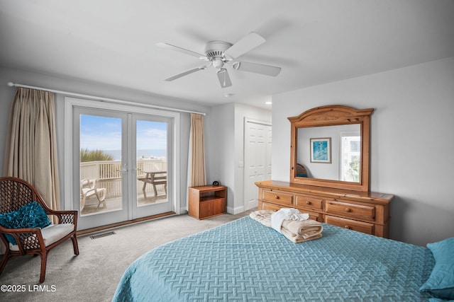 bedroom featuring access to exterior, french doors, light colored carpet, visible vents, and ceiling fan