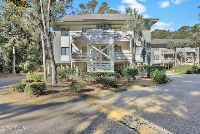 coastal home featuring a balcony