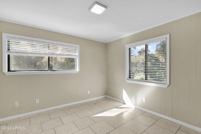 tiled empty room featuring a wealth of natural light