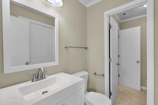 bathroom featuring tile patterned floors, ornamental molding, toilet, and vanity