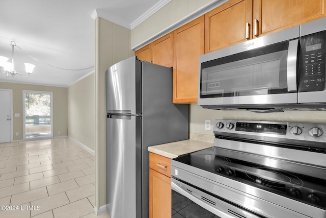 kitchen featuring an inviting chandelier, crown molding, light tile patterned flooring, and appliances with stainless steel finishes