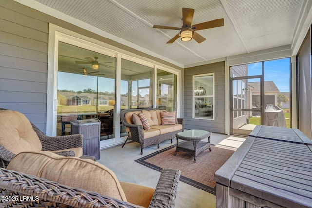 sunroom / solarium with a ceiling fan