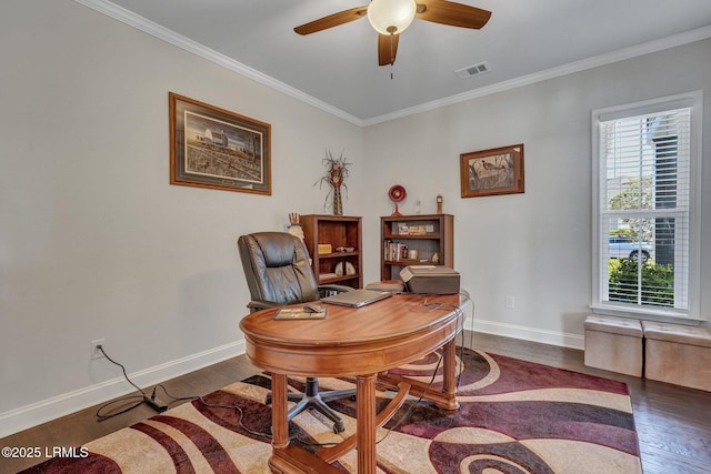 office featuring visible vents, ceiling fan, dark wood finished floors, and ornamental molding