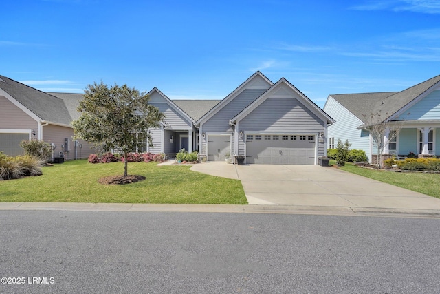 view of front of home with a garage, concrete driveway, and a front yard