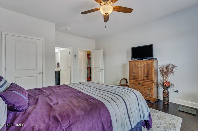 bedroom featuring visible vents, a ceiling fan, baseboards, and dark wood-style flooring