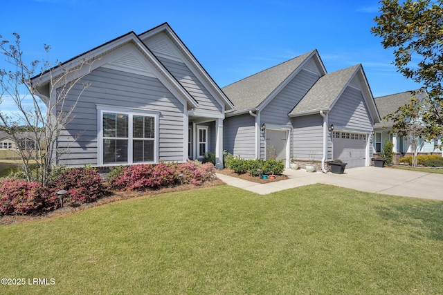 view of front of house with concrete driveway, an attached garage, a front lawn, and roof with shingles