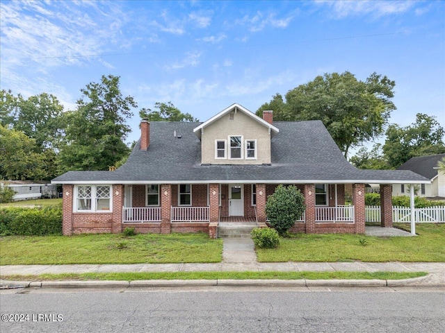 view of front of house with a front lawn and a porch