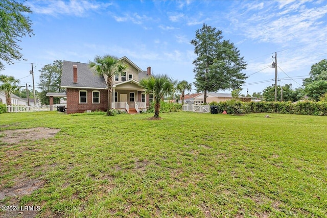 view of yard with covered porch