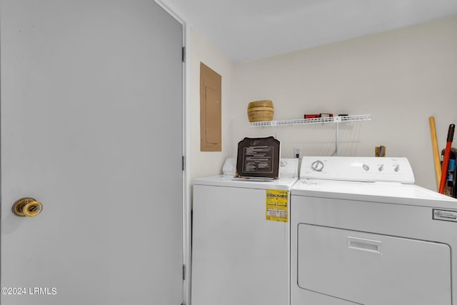 washroom featuring electric panel and washing machine and dryer