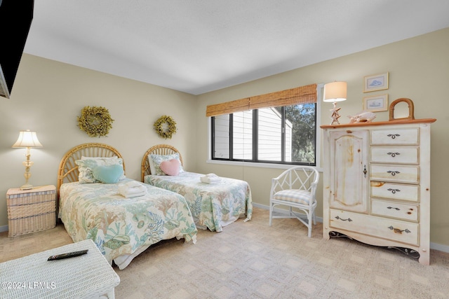 bedroom with light colored carpet