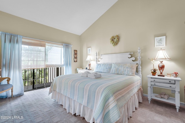 carpeted bedroom with lofted ceiling