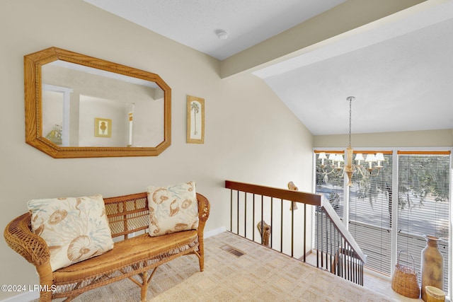 sitting room with carpet floors, lofted ceiling with beams, and a chandelier