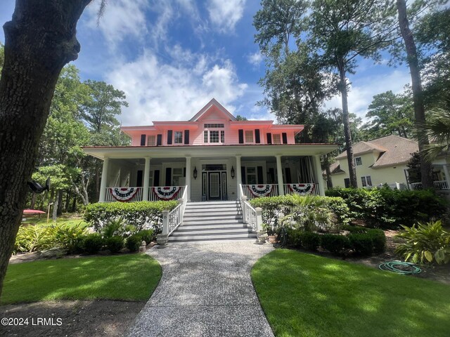 15 Jacks Dr, Daufuskie Island, SC 29915 - view of front facade featuring a front lawn and a porch