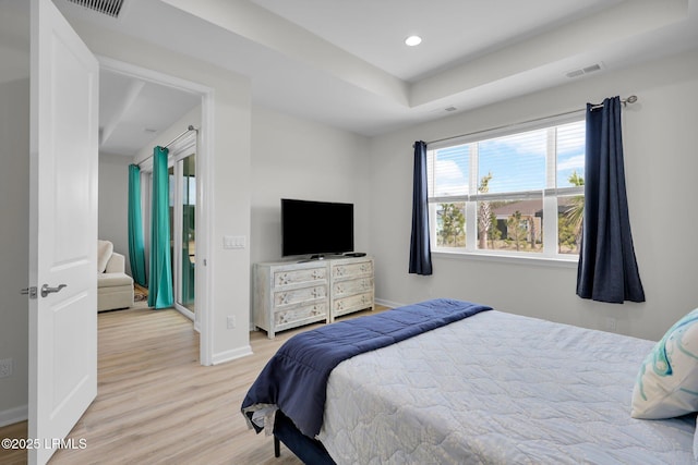 bedroom with light wood-type flooring, recessed lighting, baseboards, and visible vents