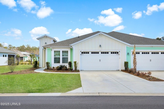 ranch-style home with driveway, an attached garage, board and batten siding, and a front yard