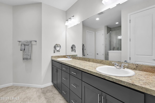 bathroom with double vanity, a sink, visible vents, and a shower stall