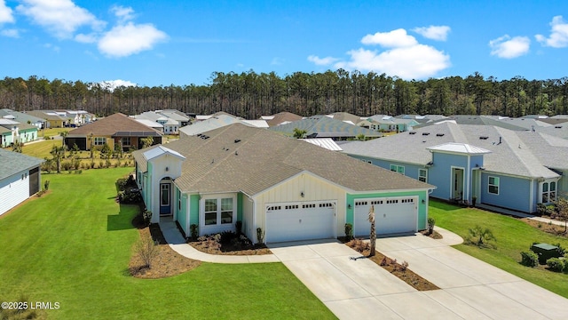 birds eye view of property with a residential view