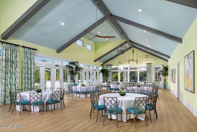 interior space featuring ceiling fan, wood finished floors, french doors, and beam ceiling