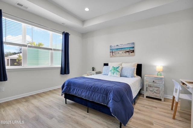 bedroom with baseboards, visible vents, wood finished floors, and recessed lighting