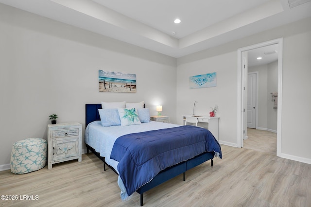 bedroom featuring baseboards, light wood finished floors, and recessed lighting