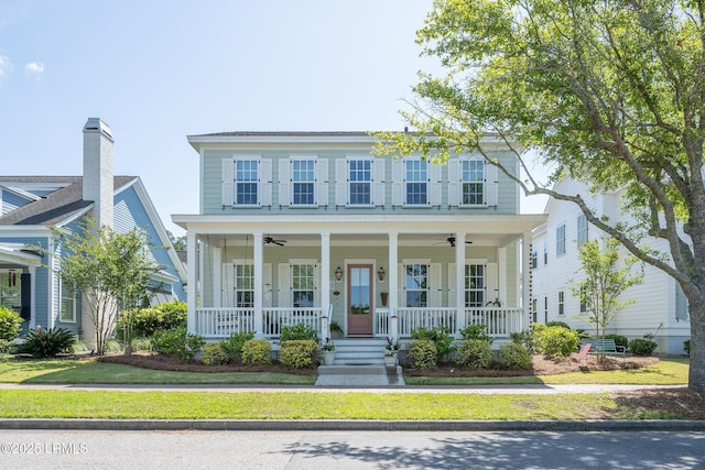 view of front of house with a ceiling fan and a porch