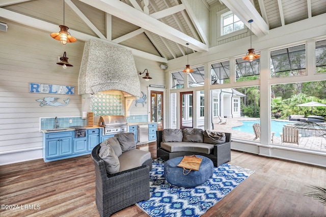 living room with beam ceiling, sink, high vaulted ceiling, and light hardwood / wood-style floors