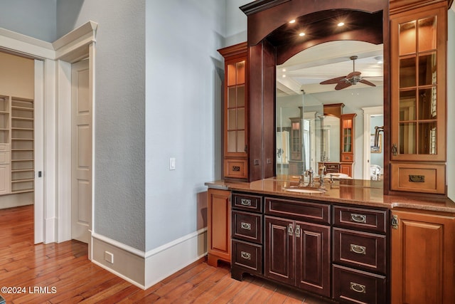 bathroom featuring ceiling fan, vanity, and hardwood / wood-style floors