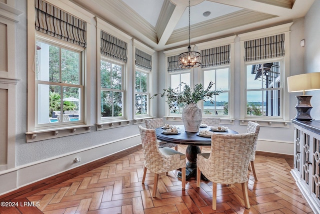 sunroom featuring a notable chandelier