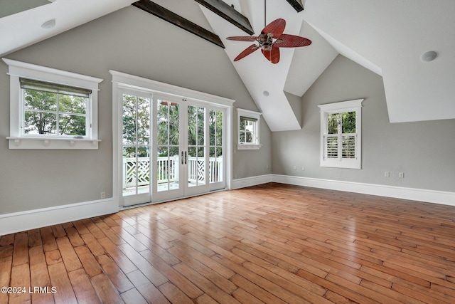 additional living space with ceiling fan, lofted ceiling, and light wood-type flooring