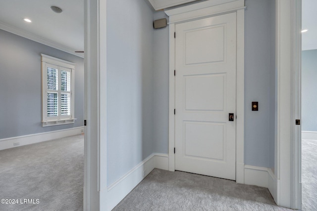 corridor with light carpet and ornamental molding