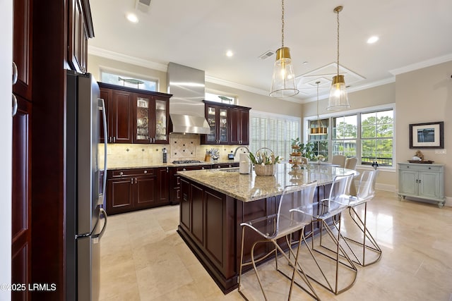 13 Mooring Line Ct Unit 1463, Bluffton, SC 29910 - kitchen with tasteful backsplash, a breakfast bar, appliances with stainless steel finishes, a sink, and ventilation hood