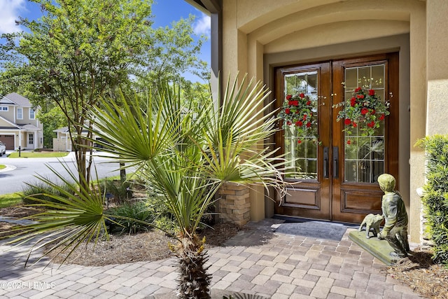 13 Mooring Line Ct Unit 1463, Bluffton, SC 29910 - view of exterior entry featuring french doors and stucco siding