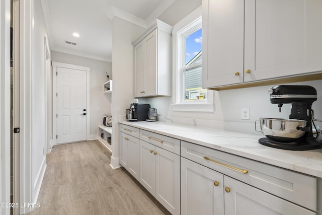 782 Azalea Dr, Hardeeville, SC 29927 - kitchen with crown molding, light wood-style flooring, light stone counters, baseboards, and recessed lighting