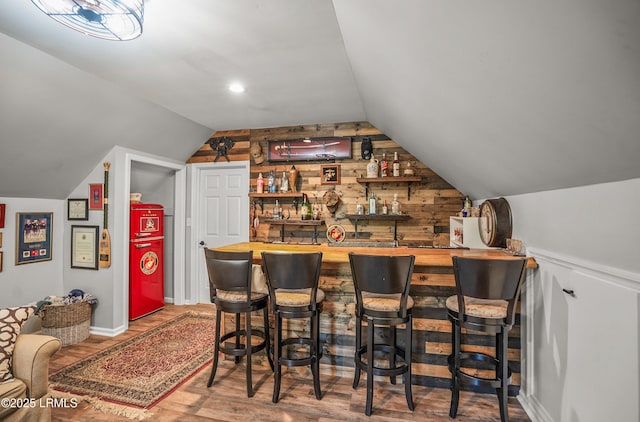 70 Dolphin Point Dr, Beaufort, SC 29907 - indoor wet bar with wooden walls, lofted ceiling, and wood finished floors