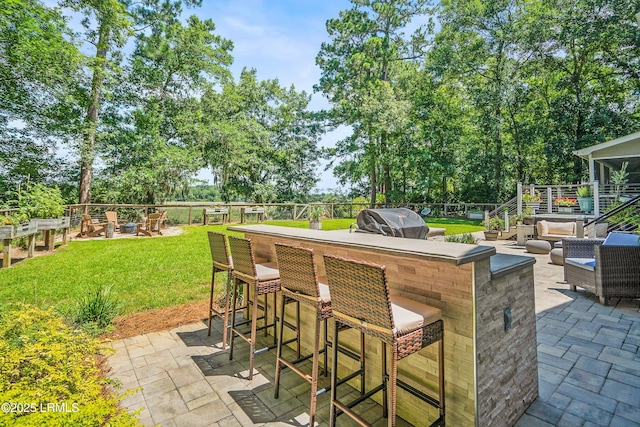 70 Dolphin Point Dr, Beaufort, SC 29907 - view of patio / terrace with a grill and an outdoor living space with a fire pit